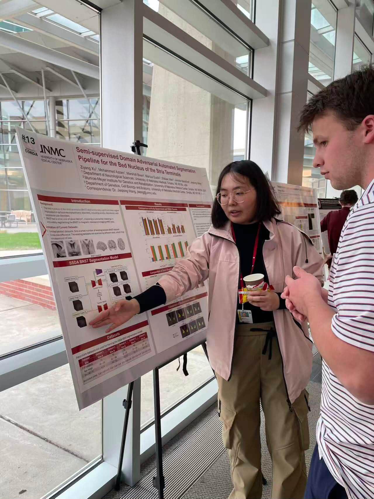 Ruobing presents a poster on Semi-supervised Domain Adversarial Automated Segmentation Pipeline for the Bed Nucleus of the Stria Terminalis at CoNDA Center Colloquium.